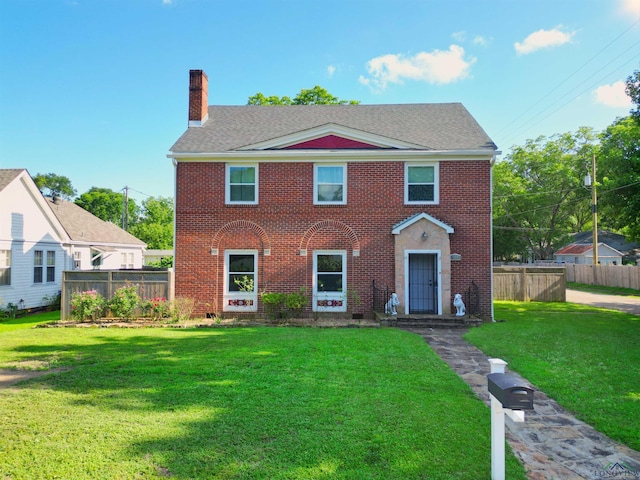 400 Shirley St, Marshall, TX 75670 - colonial house featuring a chimney, brick siding, and a shingled roof