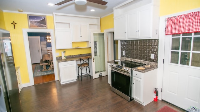 kitchen featuring ceiling fan, white cabinets, and stainless steel appliances