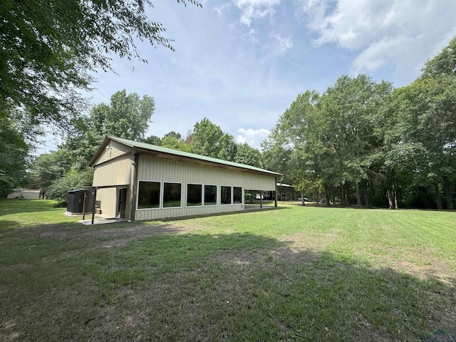 226 Almand, Waskom, TX 75692 - view of property exterior featuring a lawn and cooling unit