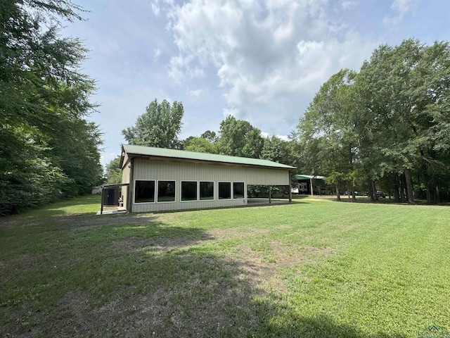 226 Almand, Waskom, TX 75692 - back of house featuring a yard