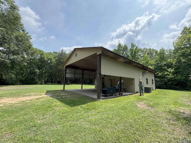 226 Almand, Waskom, TX 75692 - view of pole building with central AC, a lawn, and a carport