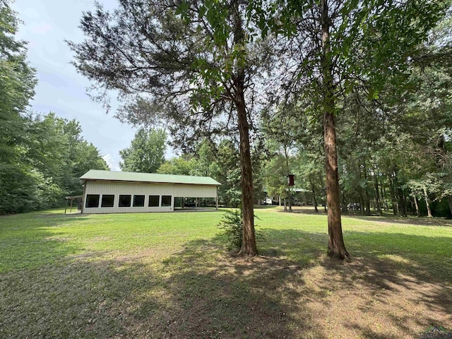 226 Almand, Waskom, TX 75692 - view of front of home with a front lawn and metal roof