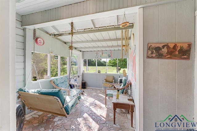 sunroom with beam ceiling