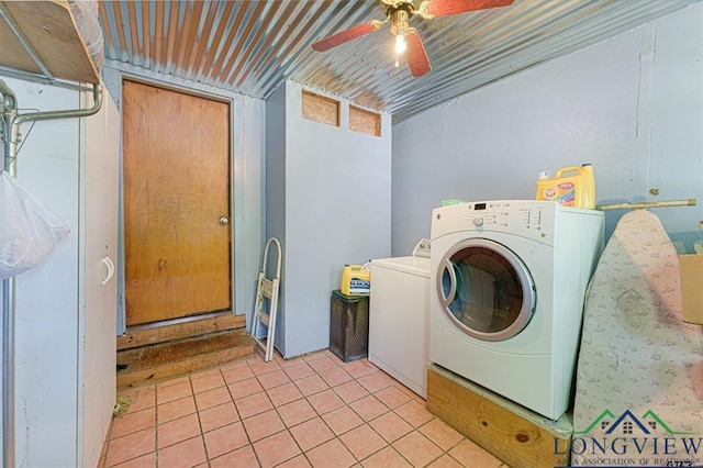 clothes washing area featuring ceiling fan, washer and clothes dryer, and light tile patterned floors