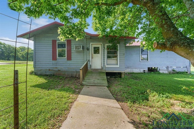 bungalow-style house featuring a front yard