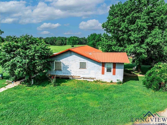 view of property exterior featuring a yard