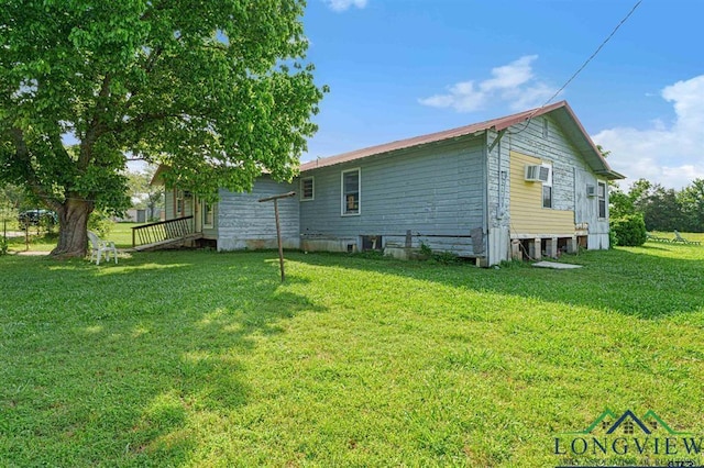 back of house featuring a yard