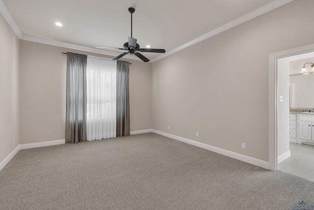 empty room featuring ceiling fan, ornamental molding, and light carpet