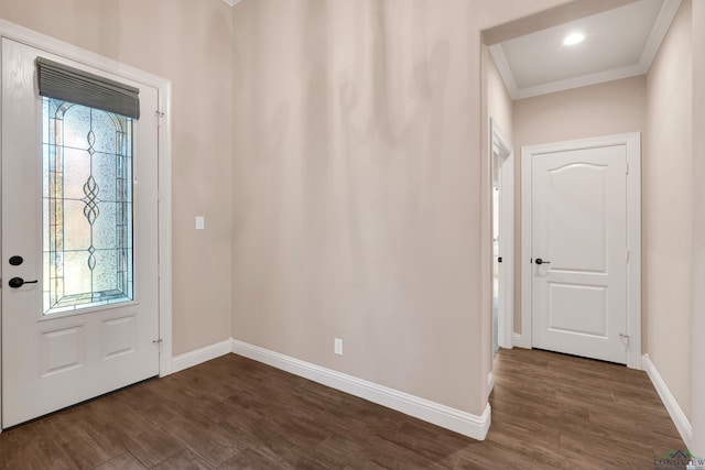 foyer entrance with plenty of natural light, dark hardwood / wood-style flooring, and ornamental molding