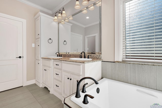 bathroom featuring tile patterned flooring, vanity, a bathtub, and crown molding