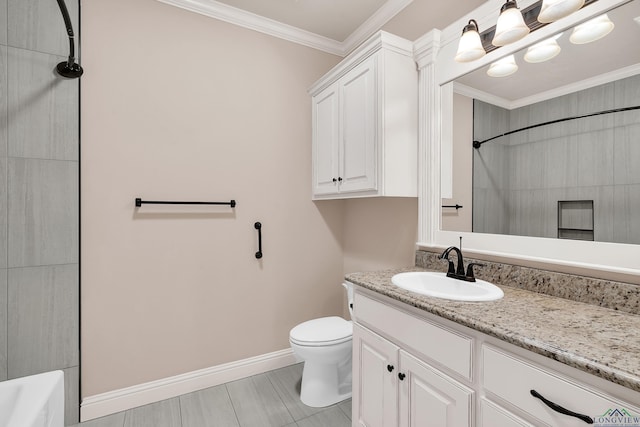 bathroom with crown molding, vanity, and toilet