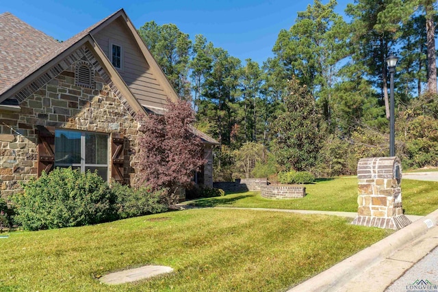 view of home's exterior with a yard