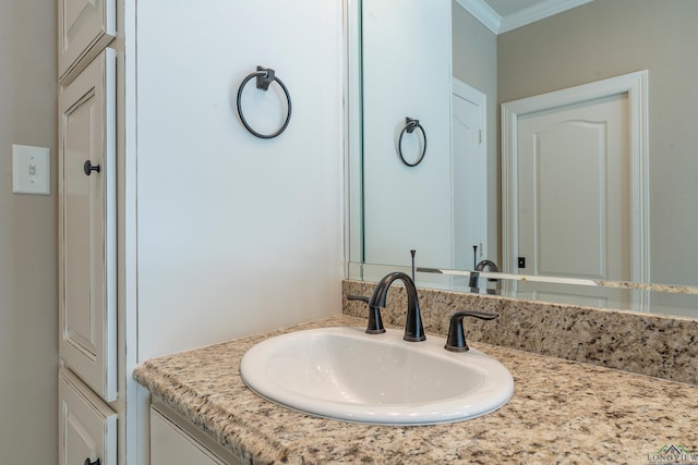 bathroom with vanity and crown molding