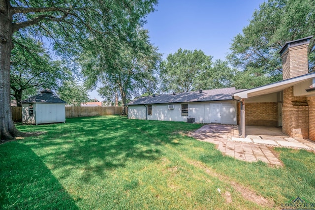 1800 N Shenandoah Ct, Longview, TX 75605 - view of yard featuring a patio area, a shed, and an outdoor structure
