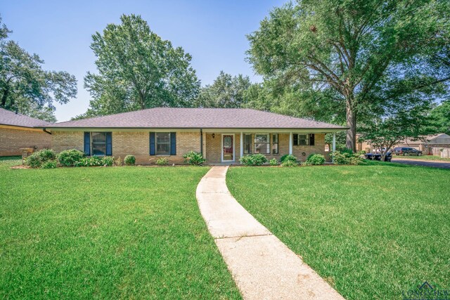1800 N Shenandoah Ct, Longview, TX 75605 - ranch-style house featuring a front lawn and brick siding