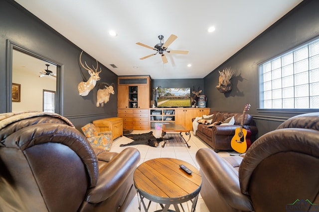 living room featuring light tile patterned floors and ceiling fan