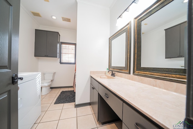 bathroom featuring tile patterned floors, washer / clothes dryer, crown molding, toilet, and vanity