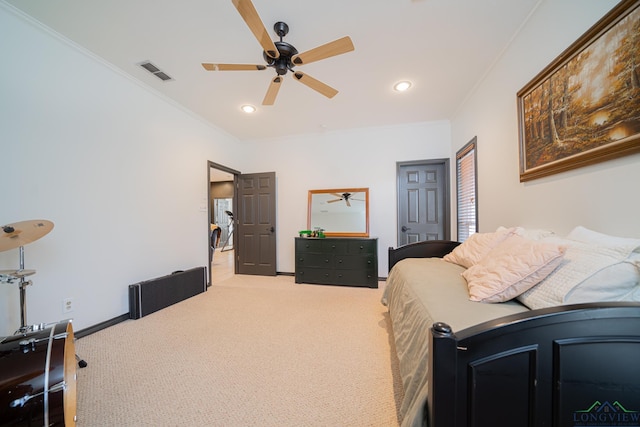 carpeted bedroom featuring ceiling fan and ornamental molding