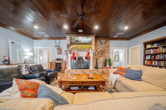 living room featuring crown molding, a fireplace, ceiling fan, and wood ceiling