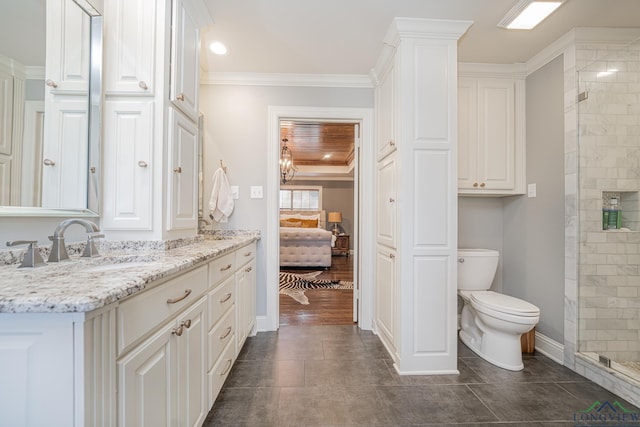 bathroom featuring crown molding, vanity, an enclosed shower, and toilet