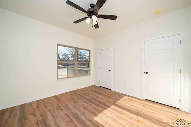 unfurnished bedroom featuring ceiling fan and light hardwood / wood-style flooring