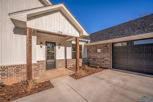 view of exterior entry featuring a garage