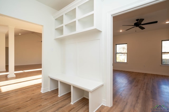 mudroom featuring hardwood / wood-style floors, ceiling fan, and ornate columns