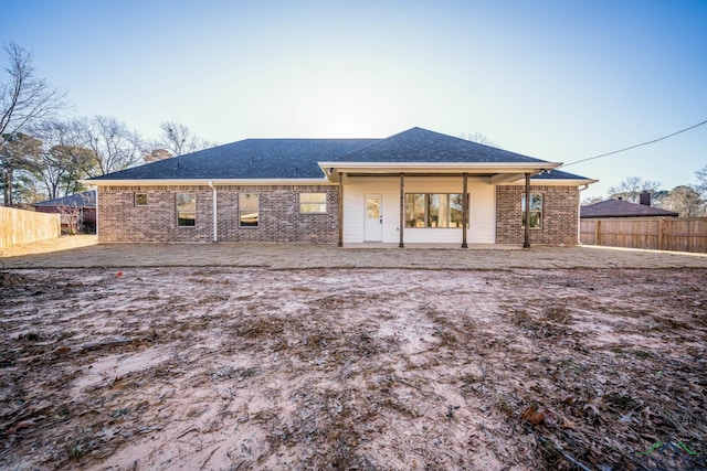 rear view of house with a patio