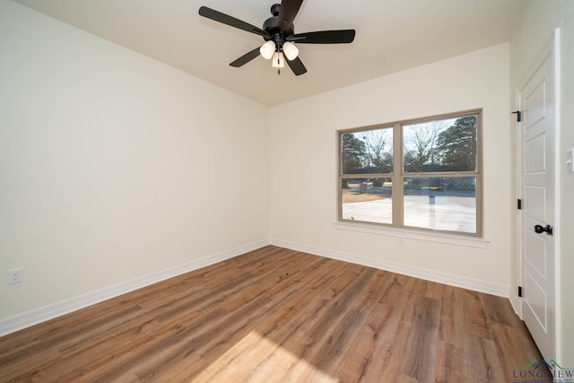 spare room featuring ceiling fan and wood-type flooring