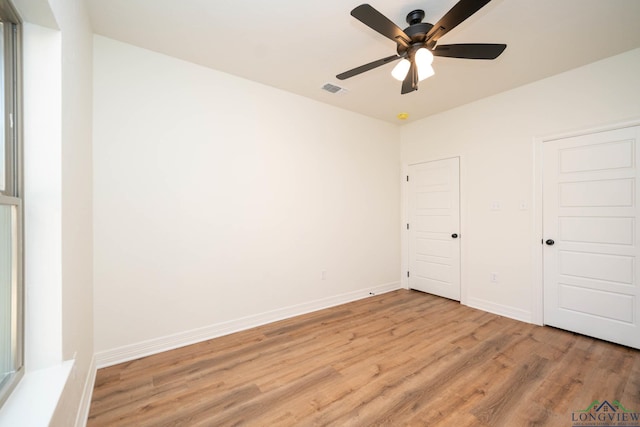 unfurnished bedroom featuring ceiling fan and light wood-type flooring