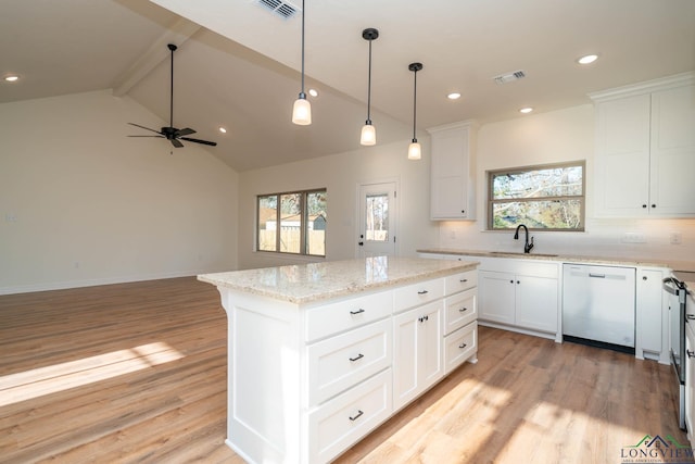 kitchen featuring white cabinetry, a center island, stainless steel dishwasher, and sink