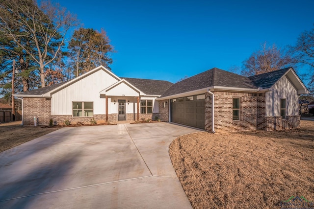 view of front of property with a front yard and a garage