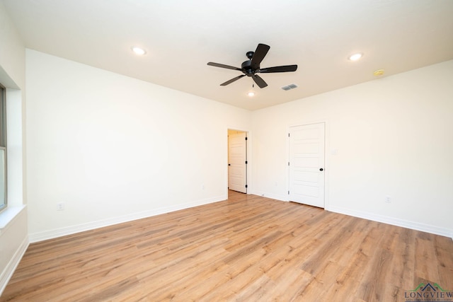 unfurnished room featuring light hardwood / wood-style floors and ceiling fan