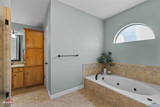 327 Forest Hls, Hallsville, TX 75650 - full bathroom featuring vanity, a tub with jets, and tile patterned floors