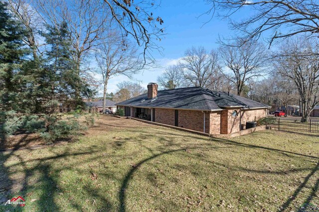 327 Forest Hls, Hallsville, TX 75650 - view of property exterior featuring a chimney and brick siding