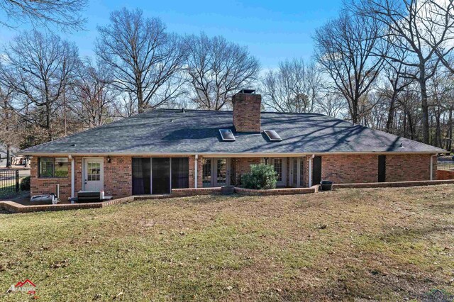 327 Forest Hls, Hallsville, TX 75650 - rear view of property featuring brick siding, a chimney, and a shingled roof