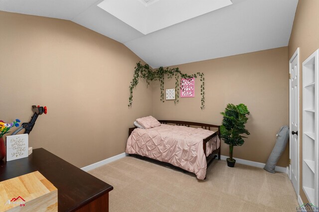 327 Forest Hls, Hallsville, TX 75650 - bedroom featuring a skylight, lofted ceiling, and light carpet