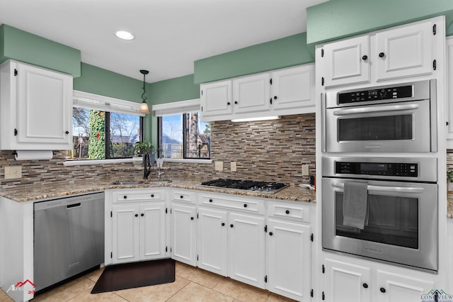 327 Forest Hls, Hallsville, TX 75650 - kitchen featuring appliances with stainless steel finishes, light tile patterned floors, white cabinets, and recessed lighting