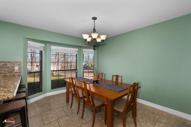 327 Forest Hls, Hallsville, TX 75650 - dining area featuring a chandelier and light tile patterned floors