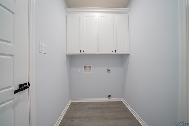 laundry room with cabinets, hookup for a washing machine, light hardwood / wood-style floors, and electric dryer hookup