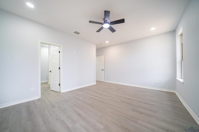 empty room featuring light hardwood / wood-style floors and ceiling fan