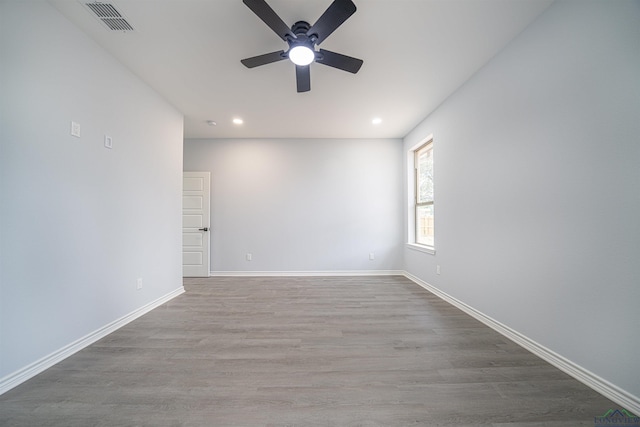 spare room featuring light hardwood / wood-style floors and ceiling fan