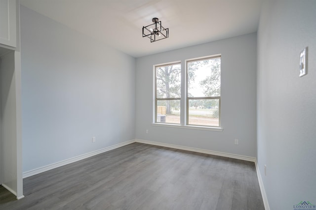 spare room with hardwood / wood-style floors