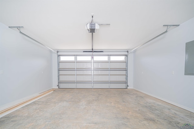 garage featuring electric panel and a garage door opener