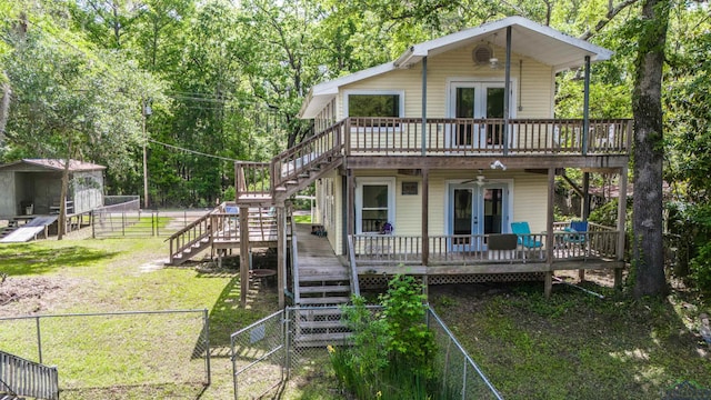 back of property with stairs, french doors, and a wooden deck