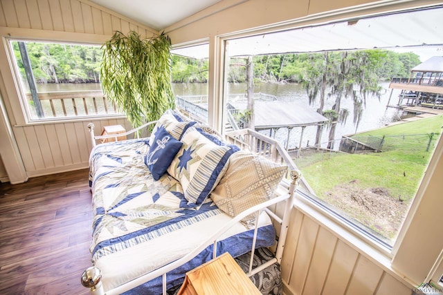 interior space with a water view and plenty of natural light