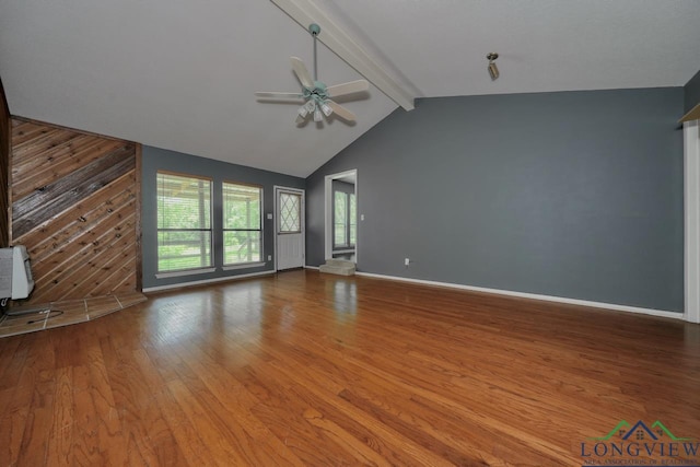 324 Highlander Hts, Hideaway, TX 75771 - unfurnished living room featuring a ceiling fan, wood finished floors, baseboards, and wooden walls