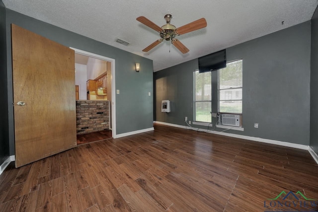 324 Highlander Hts, Hideaway, TX 75771 - empty room featuring wood finished floors, ceiling fan, cooling unit, a textured ceiling, and baseboards