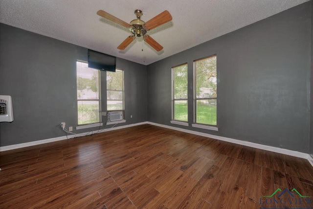 324 Highlander Hts, Hideaway, TX 75771 - empty room featuring wood finished floors, healthy amount of natural light, a ceiling fan, baseboards, and a textured ceiling