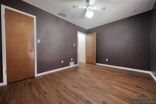 324 Highlander Hts, Hideaway, TX 75771 - unfurnished room featuring wood finished floors, a ceiling fan, a textured ceiling, and baseboards